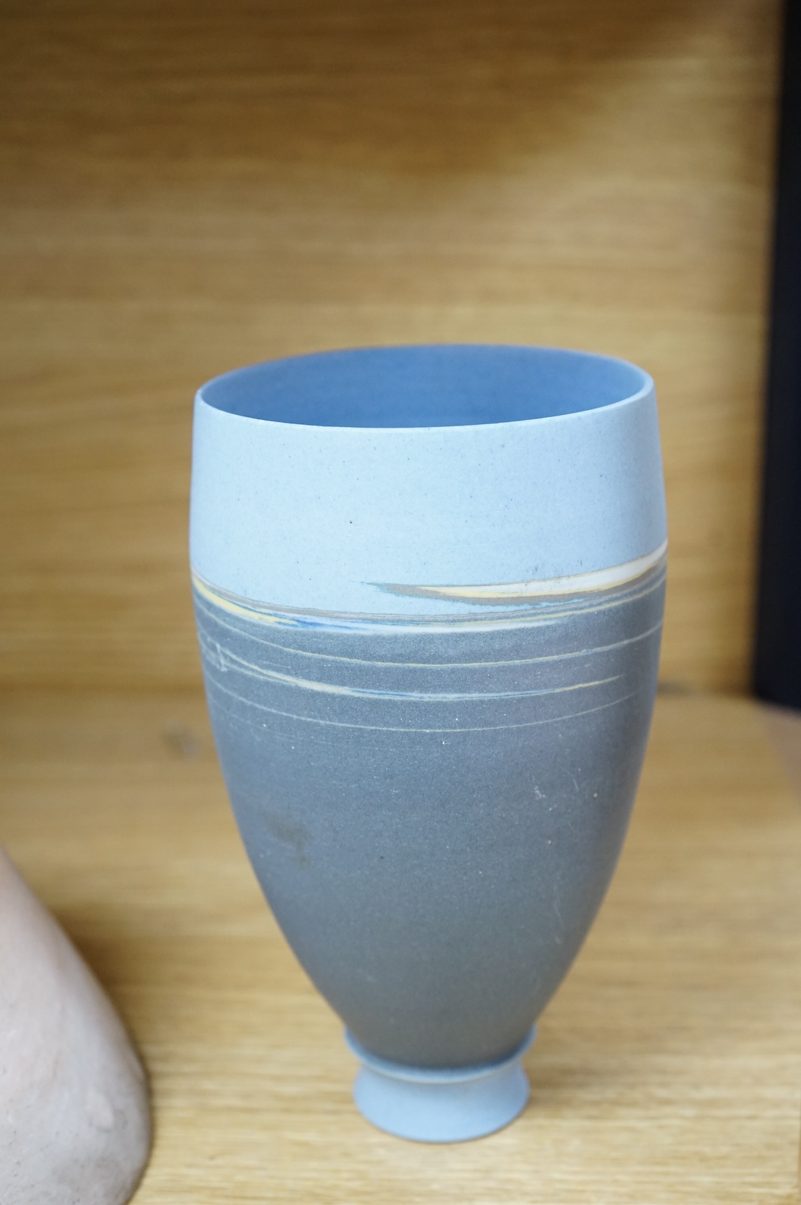 A studio pottery with incised initialled, dated ‘73 and a similar bowl, largest 21cm in diameter